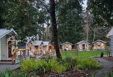 Group of tiny homes facing toward an open courtyard on Whidbey Island. 