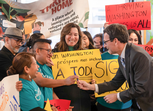 Gov Ferguson Shaking hands with immigrant activists