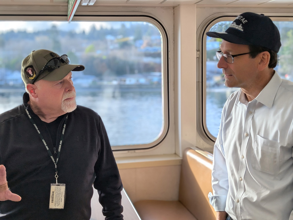 Governor Ferguson on a ferry speaking with a Washingtonian
