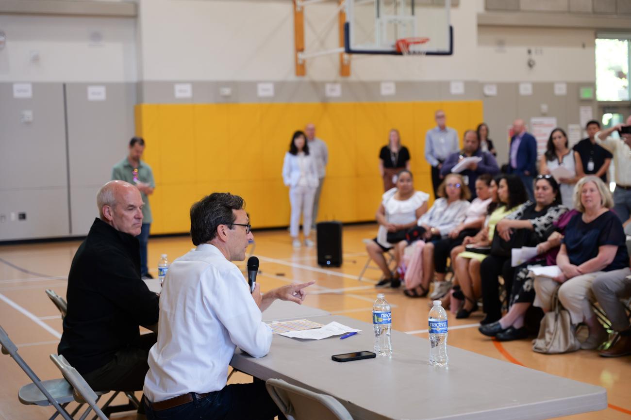 Rep. Rick Larsen and Governor Bob Ferguson listen as families, school officials share personal stories during Lynnwood Elementary listening session on Aug. 21.